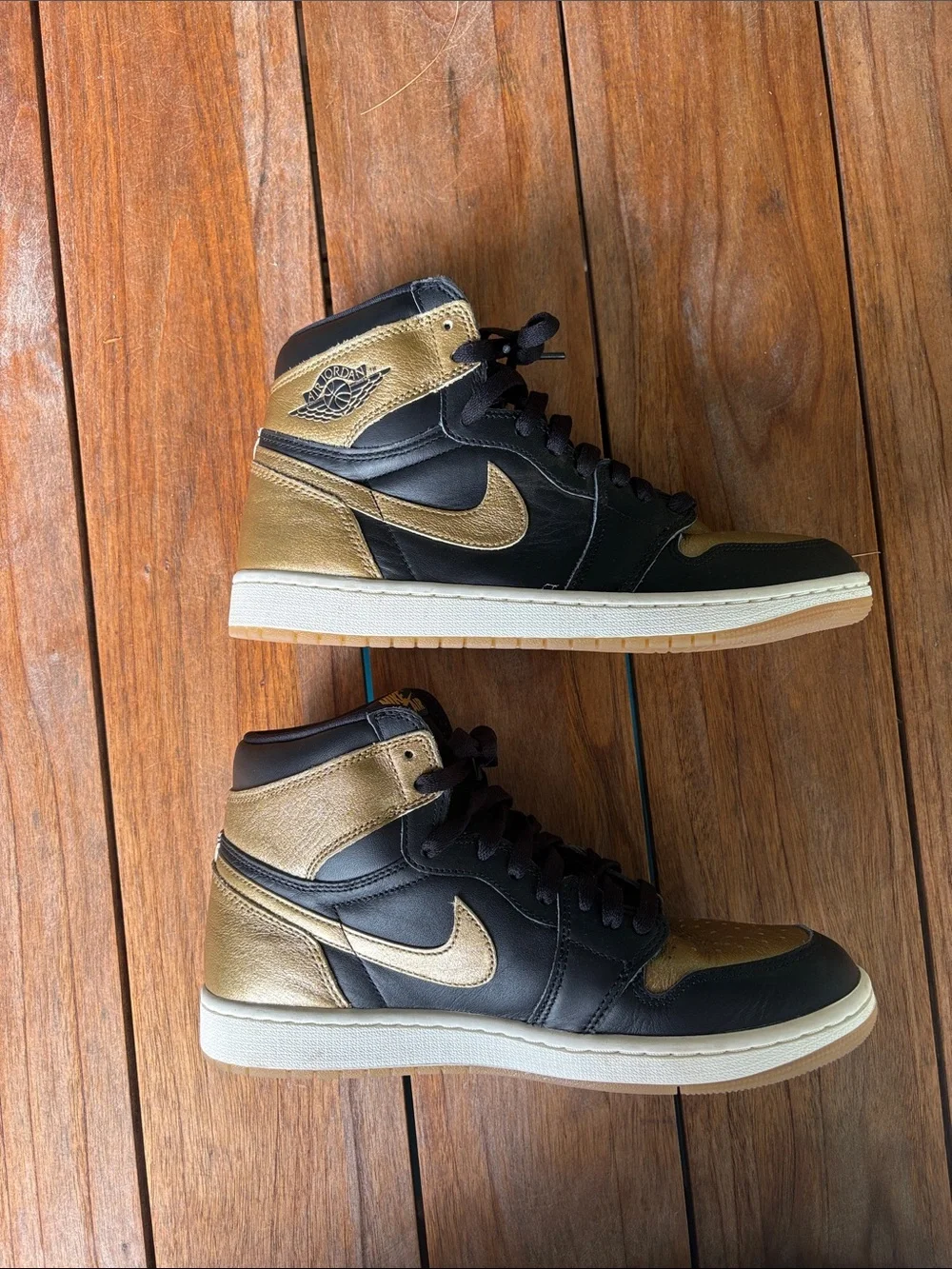 Air Jordan High-Top Sneakers in Black and Gold